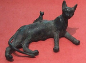 An Ancient Egyptian bronze statue of a reclining cat and kitten