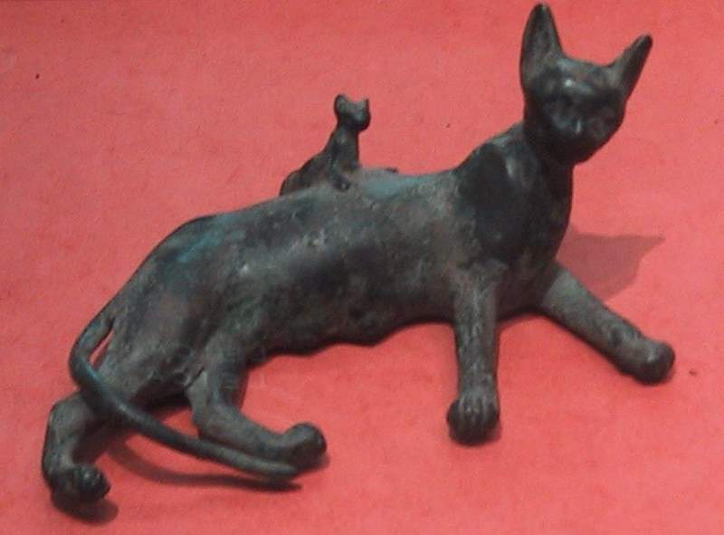 An Ancient Egyptian bronze statue of a reclining cat and kitten