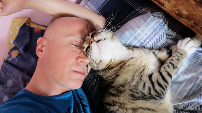 I always sleep with my cats. Sleeping with Thibaut the cat.